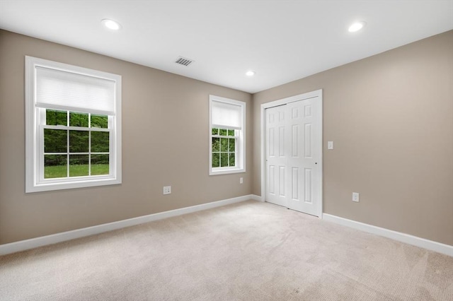 233A Green St Unit A, Boylston, MA 01505 - unfurnished bedroom featuring light colored carpet, baseboards, recessed lighting, and a closet