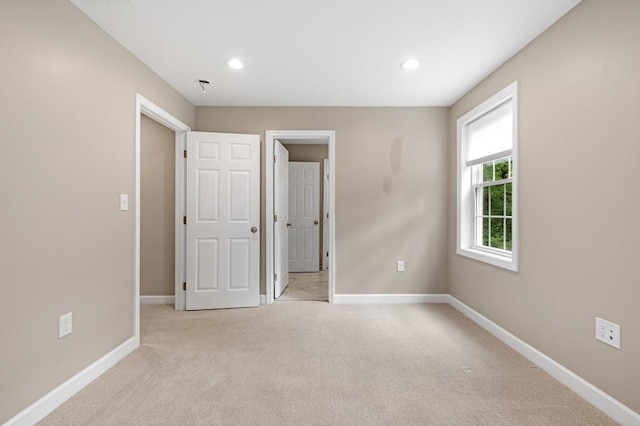 233A Green St Unit A, Boylston, MA 01505 - unfurnished bedroom with light colored carpet, baseboards, and recessed lighting