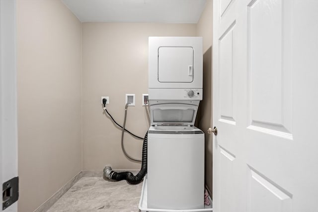 233A Green St Unit A, Boylston, MA 01505 - laundry room with stacked washer / dryer and baseboards