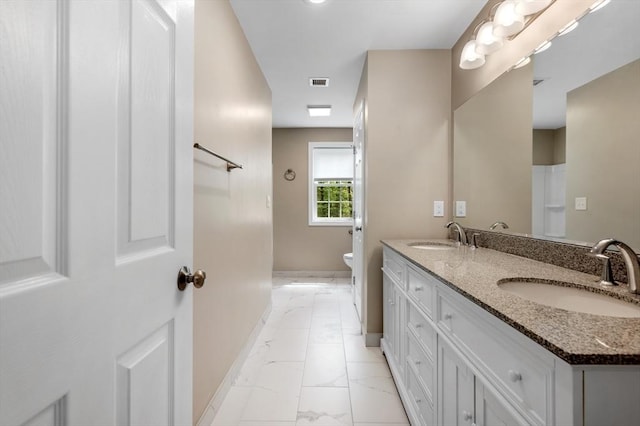 233A Green St Unit A, Boylston, MA 01505 - full bath with marble look tiles, baseboards, double vanity, and toilet
