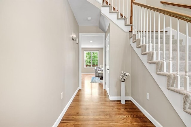 233A Green St Unit A, Boylston, MA 01505 - hall featuring wood finished floors, stairway, and baseboards