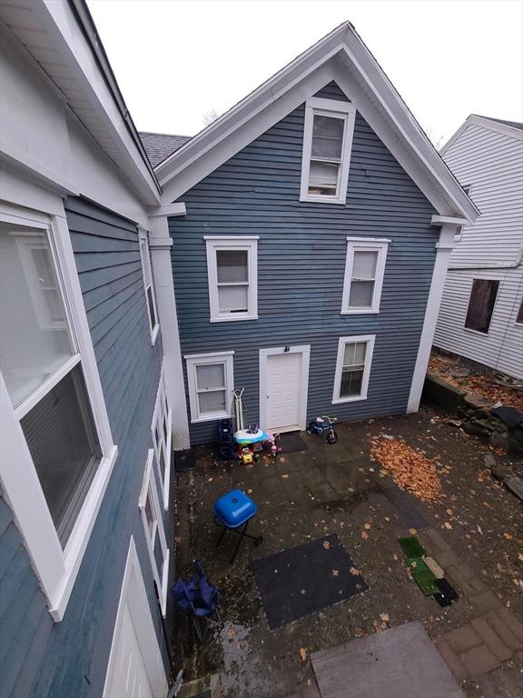 back of house with a patio