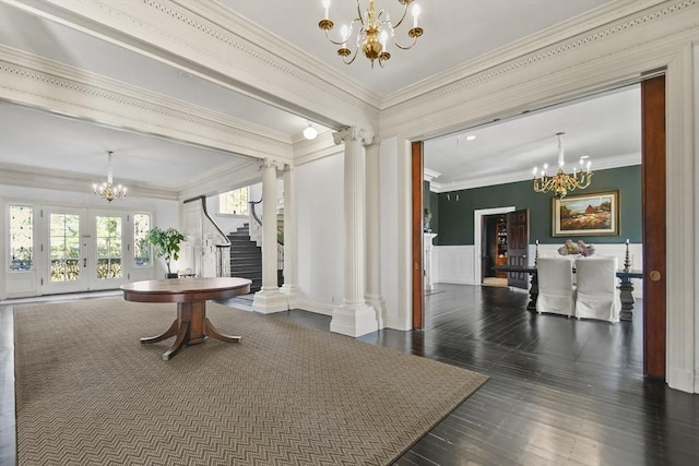 824 Tucker Rd, Dartmouth, MA 02747 - dining room with a chandelier, stairs, decorative columns, crown molding, and a wainscoted wall