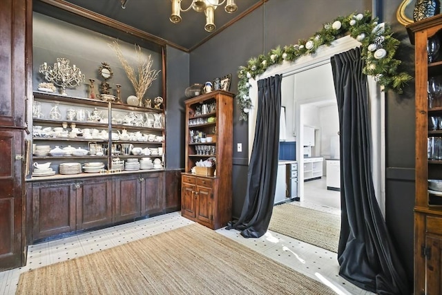 824 Tucker Rd, Dartmouth, MA 02747 - bar area with crown molding, a chandelier, and lofted ceiling