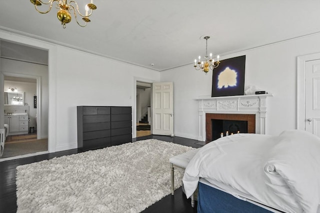 824 Tucker Rd, Dartmouth, MA 02747 - bedroom with a chandelier, a brick fireplace, baseboards, and ornamental molding