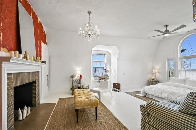 824 Tucker Rd, Dartmouth, MA 02747 - bedroom featuring a chandelier, a brick fireplace, wood finished floors, ceiling fan, and baseboards