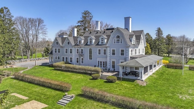 824 Tucker Rd, Dartmouth, MA 02747 - rear view of property featuring a gazebo, a lawn, a patio area, and a chimney