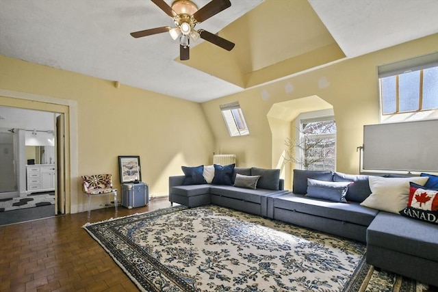 824 Tucker Rd, Dartmouth, MA 02747 - living room featuring brick floors, ceiling fan, and radiator
