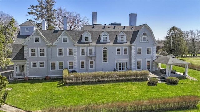 824 Tucker Rd, Dartmouth, MA 02747 - back of house featuring a yard, a patio, a gazebo, and a chimney