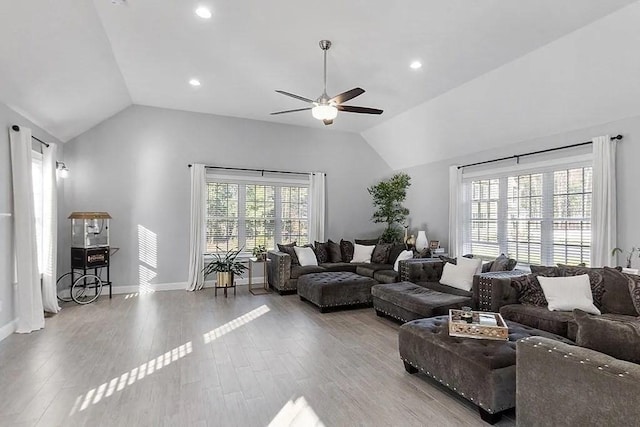 living room featuring recessed lighting, ceiling fan, wood finished floors, and lofted ceiling
