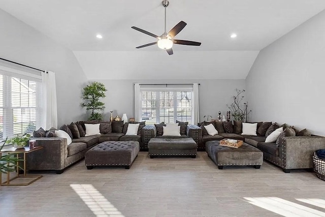 living room with recessed lighting, light wood finished floors, ceiling fan, and lofted ceiling