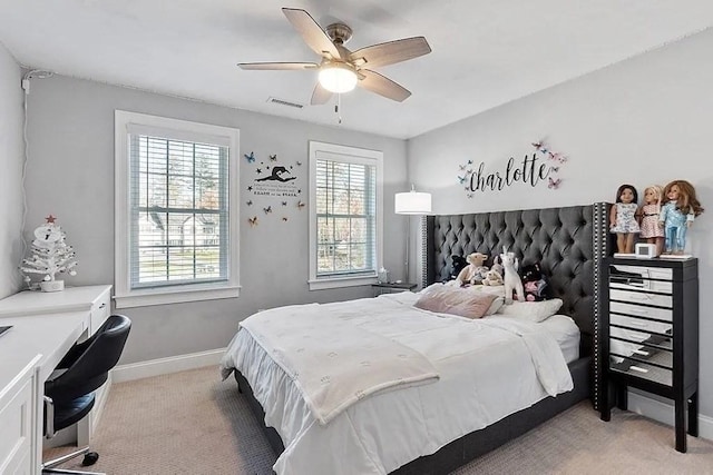 bedroom featuring baseboards, ceiling fan, carpet flooring, and visible vents