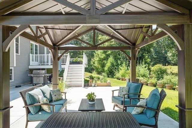 view of patio / terrace with a gazebo, an outdoor living space, stairway, and area for grilling
