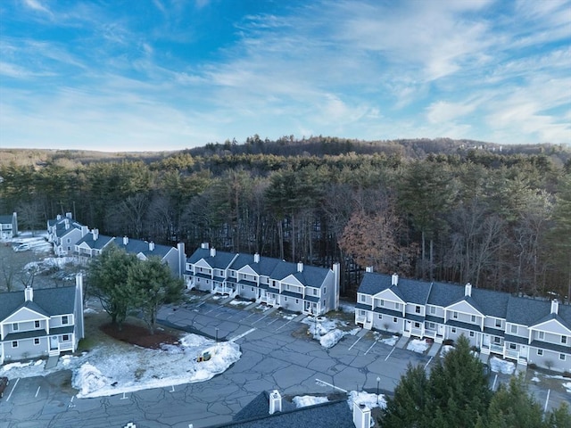 bird's eye view with a forest view and a residential view