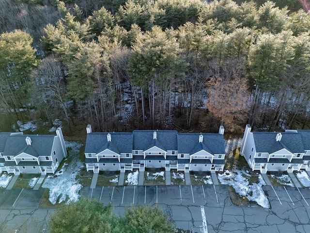 birds eye view of property with a wooded view