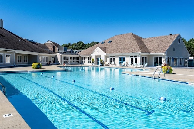 community pool with a patio area