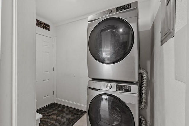 laundry area featuring stacked washer and dryer