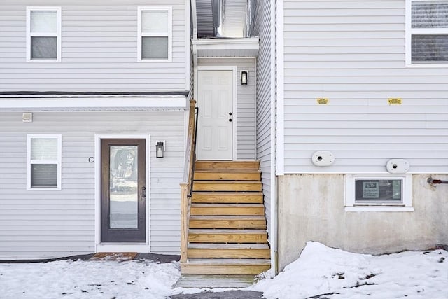 view of snow covered property entrance