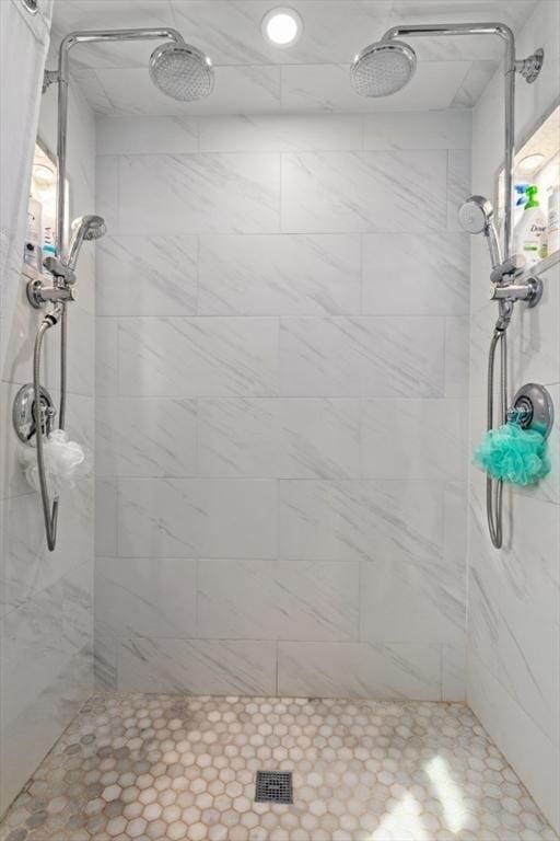 bathroom with tiled shower