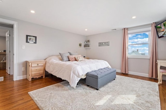 bedroom with hardwood / wood-style floors