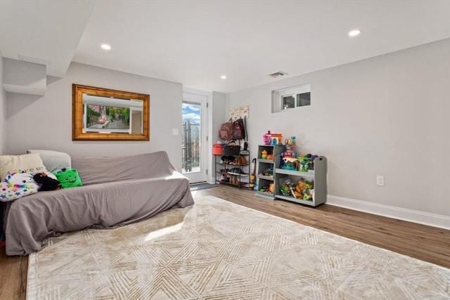 bedroom featuring access to exterior and light hardwood / wood-style flooring