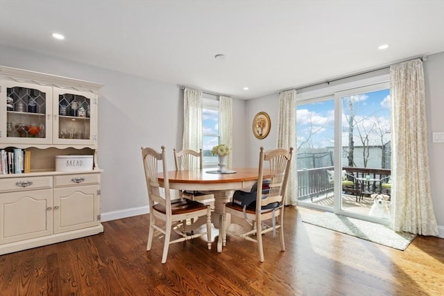 dining area with dark hardwood / wood-style floors