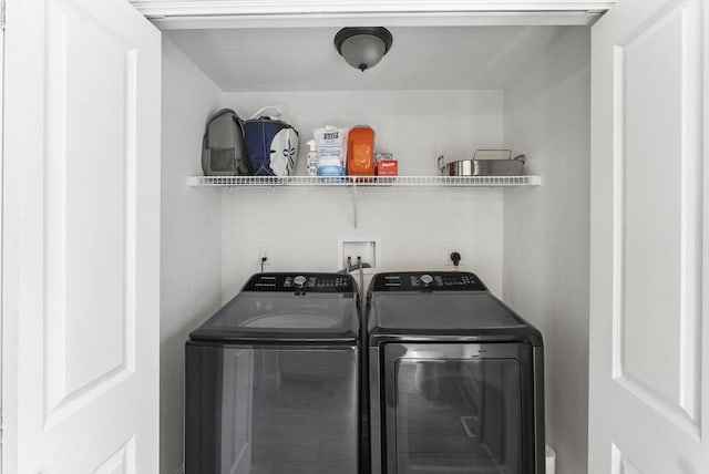 clothes washing area with laundry area and washing machine and dryer