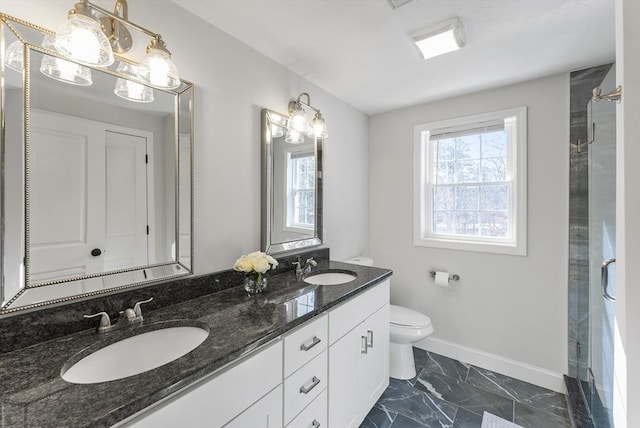 full bath with a healthy amount of sunlight, marble finish floor, and a sink