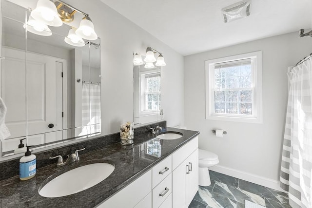 full bathroom with a sink, visible vents, baseboards, and toilet