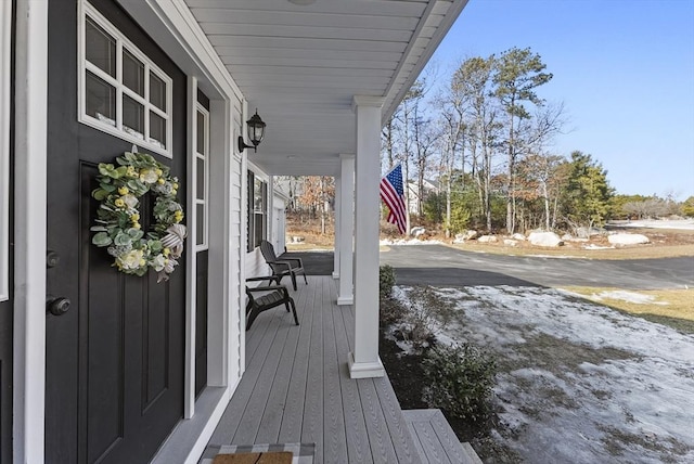 wooden terrace with a porch