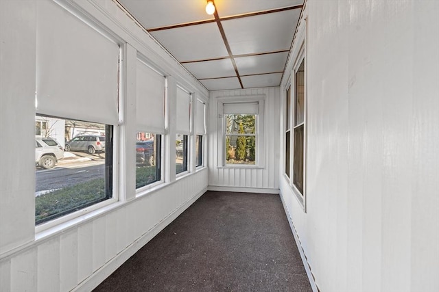 unfurnished sunroom featuring plenty of natural light