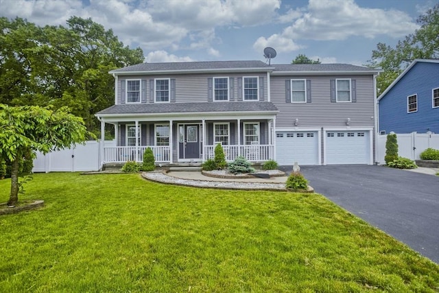 210 Naismith, Springfield, MA 01104 - view of front of house with driveway, covered porch, and an attached garage