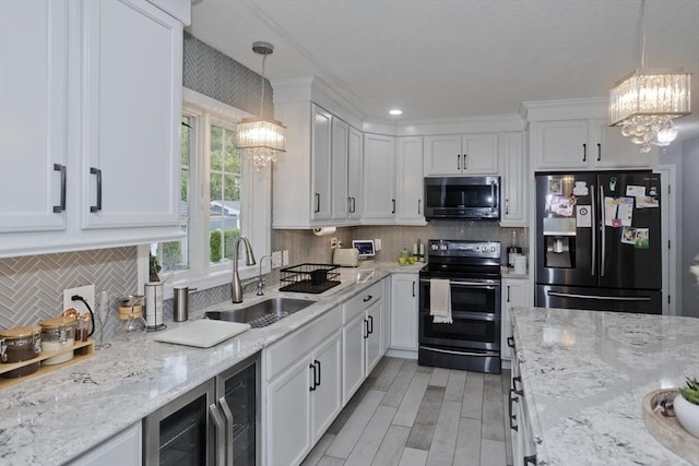 210 Naismith, Springfield, MA 01104 - kitchen featuring black fridge, range with electric cooktop, a chandelier, stainless steel microwave, and beverage cooler