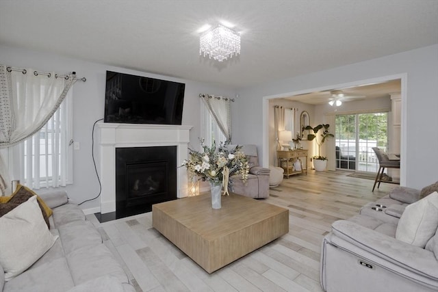 210 Naismith, Springfield, MA 01104 - living area with a fireplace, light wood-type flooring, and a ceiling fan