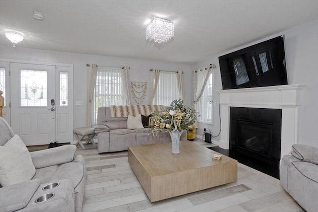 210 Naismith, Springfield, MA 01104 - living room with a fireplace with flush hearth and light wood-type flooring