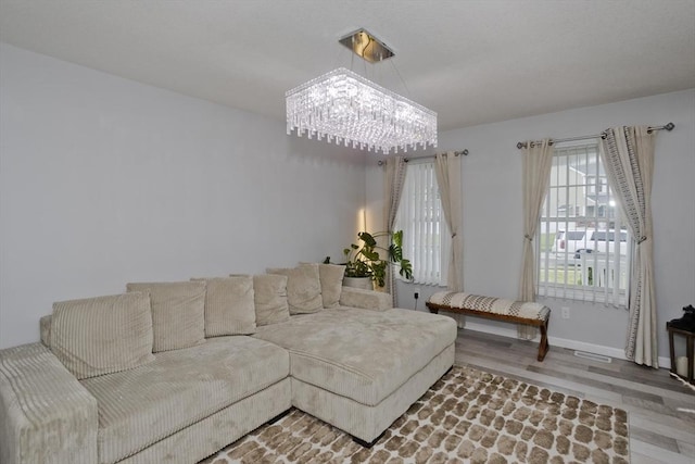 210 Naismith, Springfield, MA 01104 - living area featuring a chandelier and wood finished floors