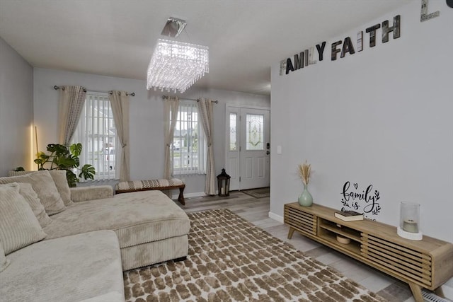 210 Naismith, Springfield, MA 01104 - living area with a chandelier and wood finished floors