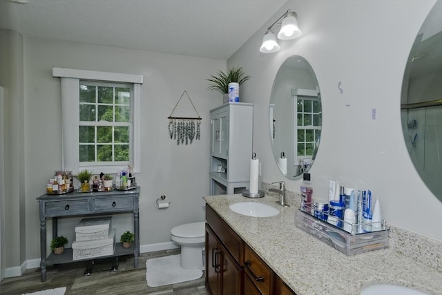 210 Naismith, Springfield, MA 01104 - full bathroom featuring double vanity, wood finished floors, and an enclosed shower