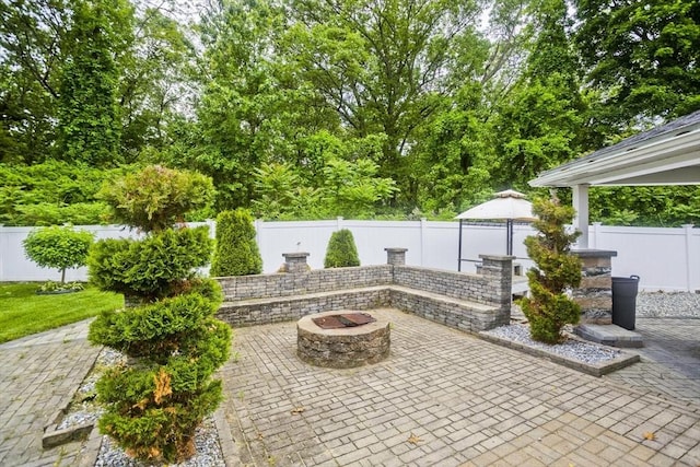 210 Naismith, Springfield, MA 01104 - fenced backyard with a patio and a fire pit
