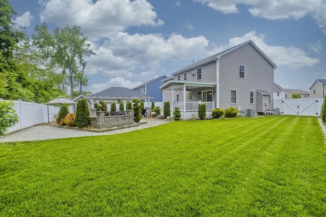 210 Naismith, Springfield, MA 01104 - back of house with a gazebo, a gate, and a fenced backyard