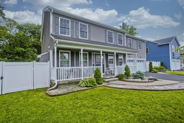 210 Naismith, Springfield, MA 01104 - view of front of home featuring a porch, asphalt driveway, and an attached garage