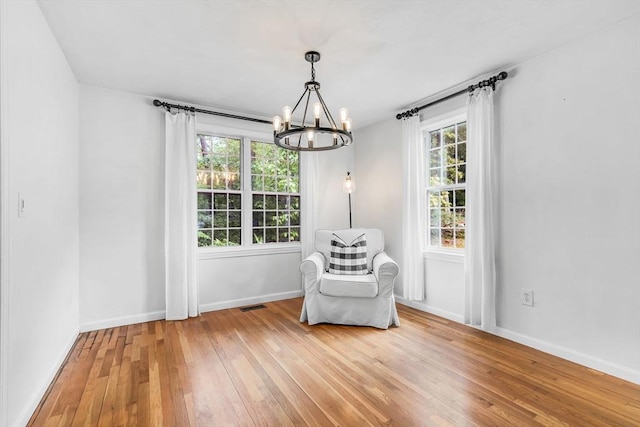12 Blueberry Ln, Hudson, MA 01749 - sitting room with a chandelier, light wood-style flooring, and baseboards