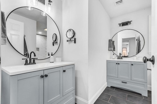 12 Blueberry Ln, Hudson, MA 01749 - full bath featuring baseboards, two vanities, and tile patterned floors
