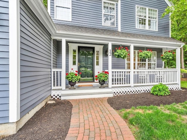 12 Blueberry Ln, Hudson, MA 01749 - doorway to property with a porch and a shingled roof
