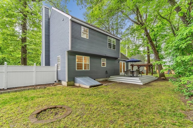 12 Blueberry Ln, Hudson, MA 01749 - back of house with a wooden deck and a chimney