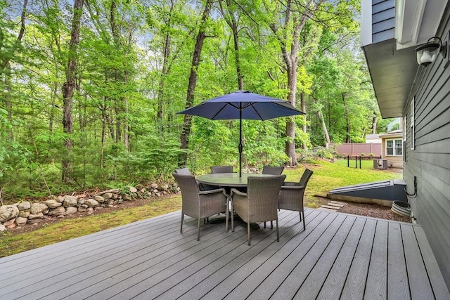 12 Blueberry Ln, Hudson, MA 01749 - wooden terrace with outdoor dining area and central AC unit