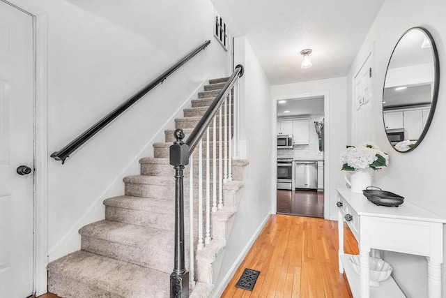 12 Blueberry Ln, Hudson, MA 01749 - stairway with wood-type flooring