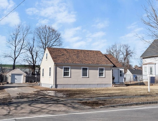 view of home's exterior featuring a garage and an outdoor structure