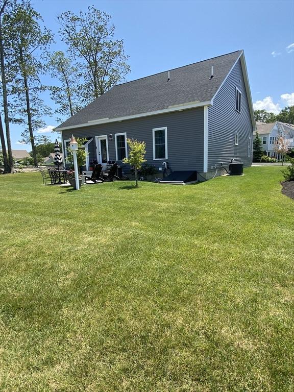 8 Salisbury Hill Blvd Unit 76, Worcester, MA 01609 - back of house with a yard and roof with shingles