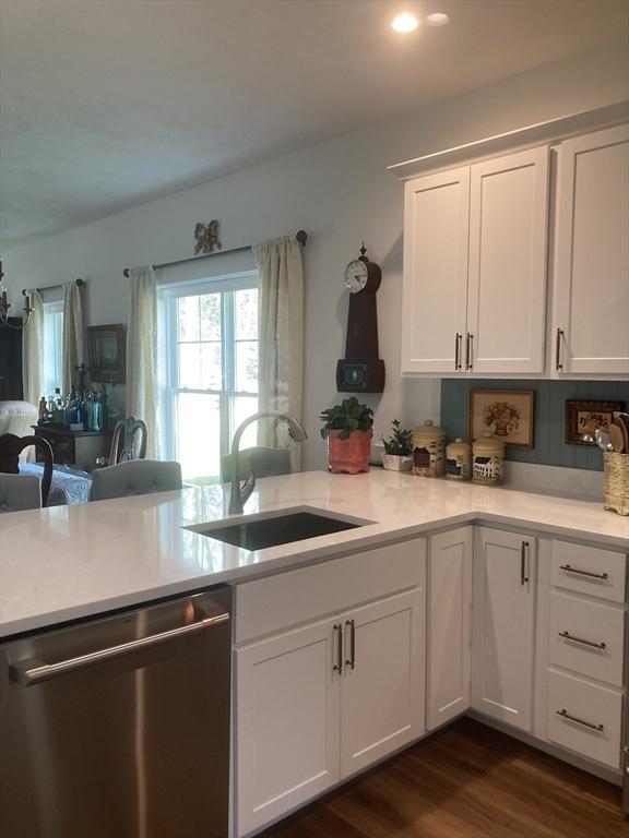 8 Salisbury Hill Blvd Unit 76, Worcester, MA 01609 - kitchen with stainless steel dishwasher, light countertops, white cabinets, dark wood-style floors, and recessed lighting